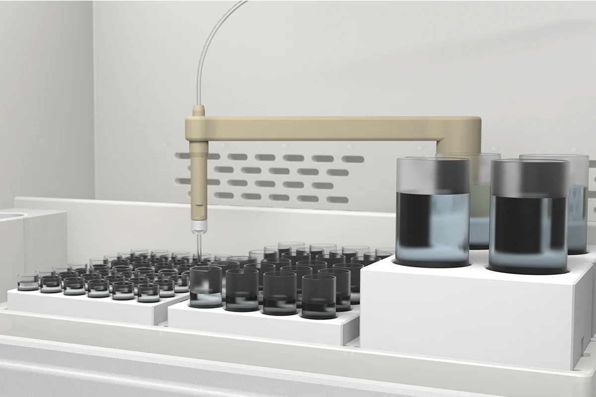 Pipette probe positioned above a black sample vial in an automated laboratory analysis system.